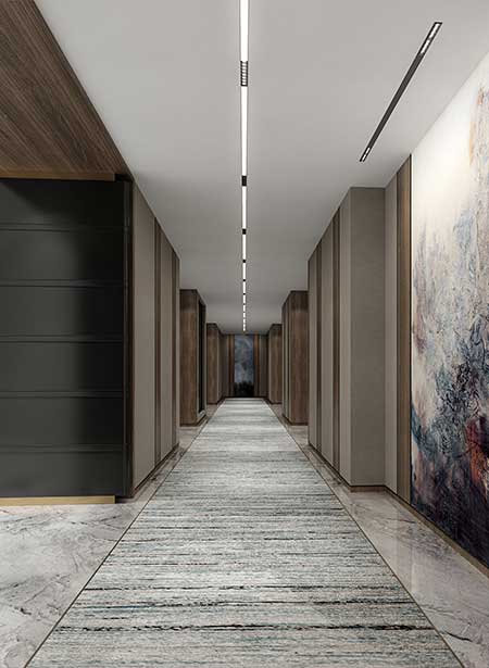 Corridor featuring 3Gi with liniar diffused light, glare-controlling multicells, and wallwashers